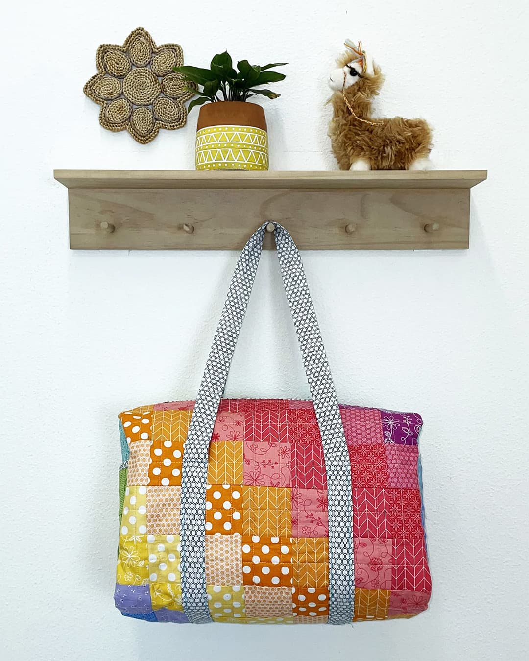 Image of Kimberbell duffle brighlights